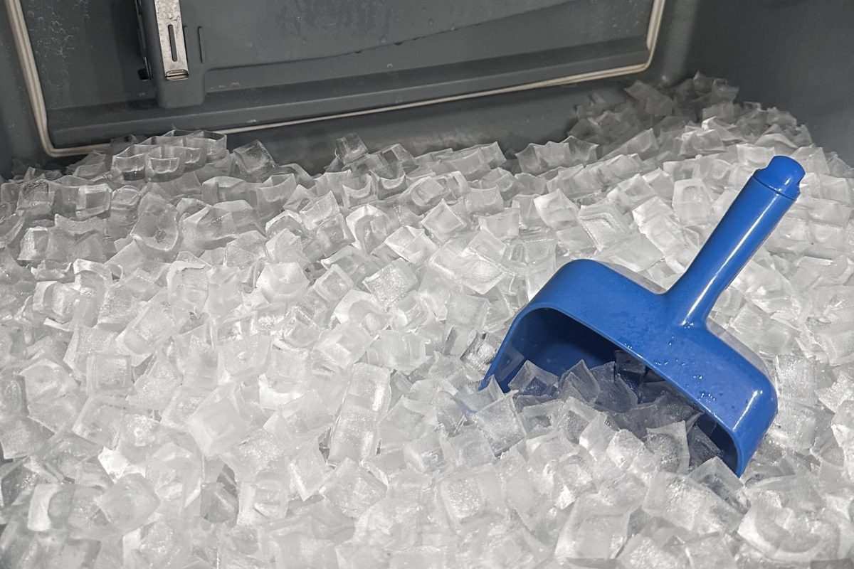 cropImage_20250905_105356_319 Ice and ice scoop in a Manitowoc ice machine bin
